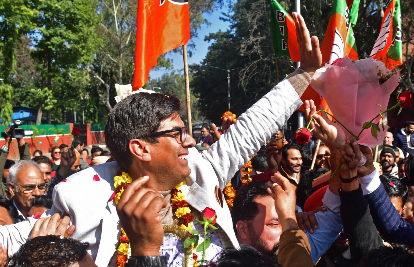 Holding picture of his father, Saurabh Joshi pledges people-first governance