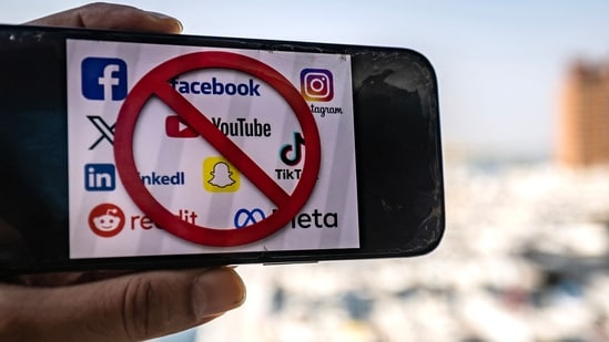 The logos of social media apps with a prohibition sign. The UAE announced a social media ban for children under 15 on June 18, joining a growing group of countries, including Australia, Britain and Canada, to take similar measures. (AFP)